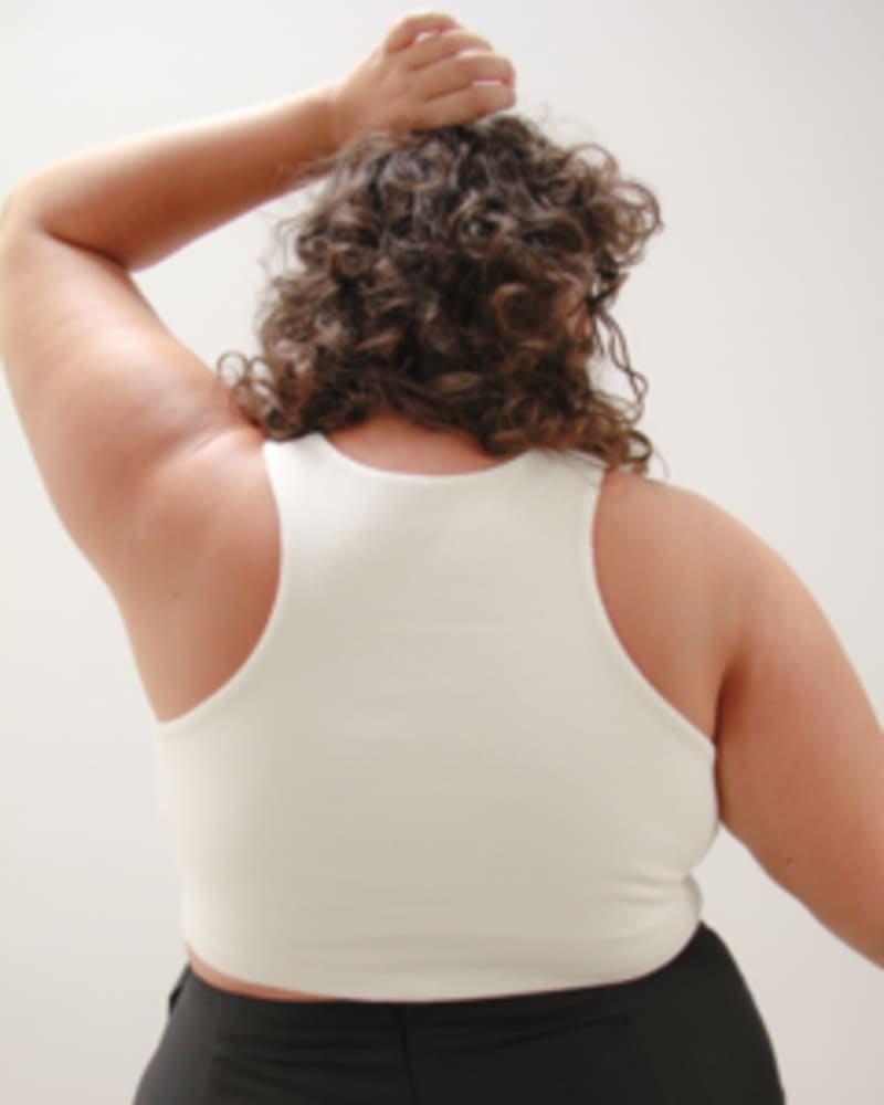 Back of a model wearing a size L Gem Cropped Tank in Pearl by Lovefool. | dia_product_style_image_id:249760